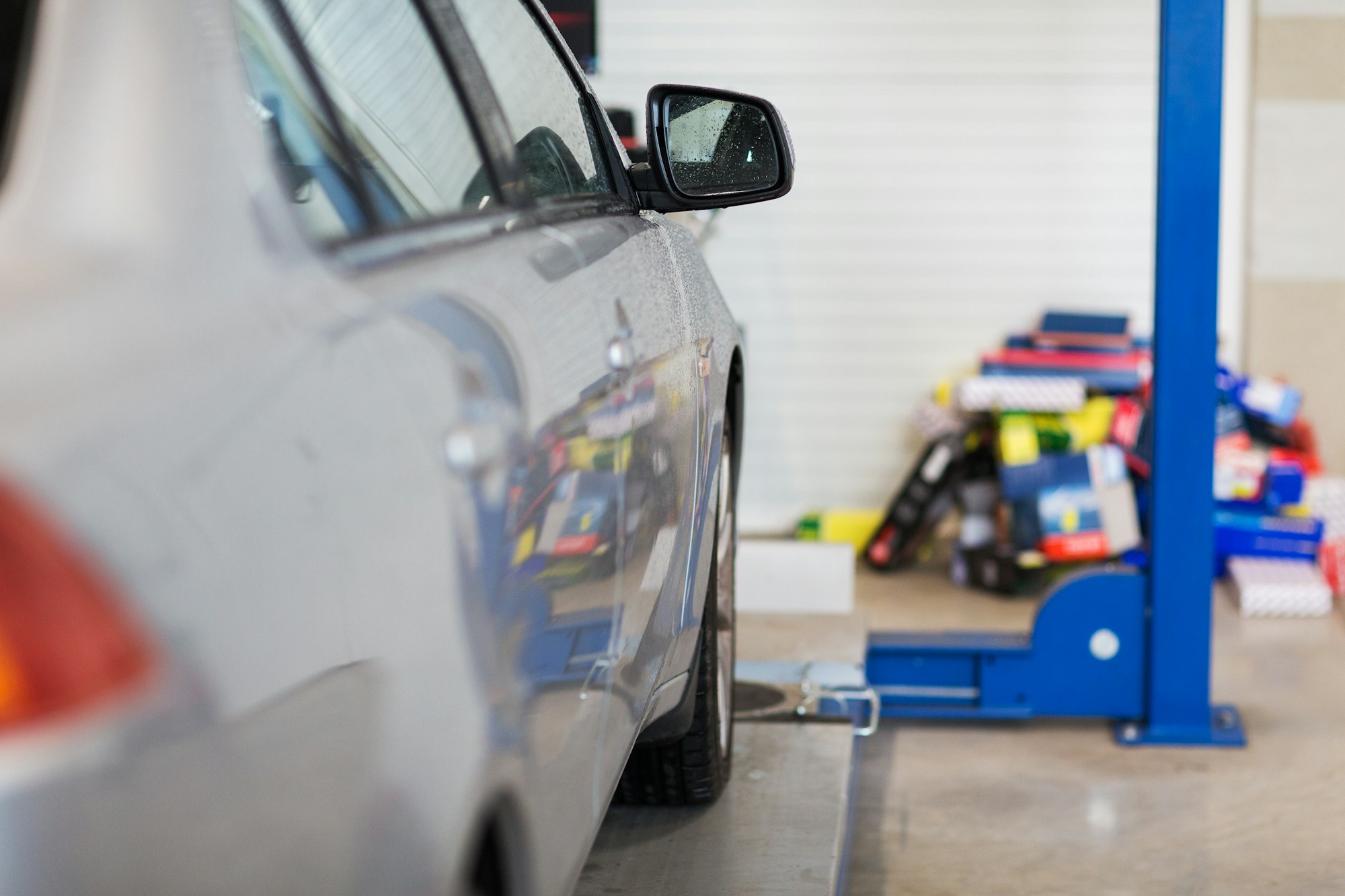 car on lift at repair station